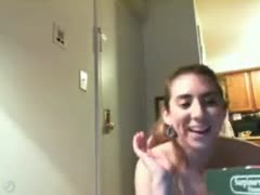 The pizza guy is let in by the attractive but undressed woman.